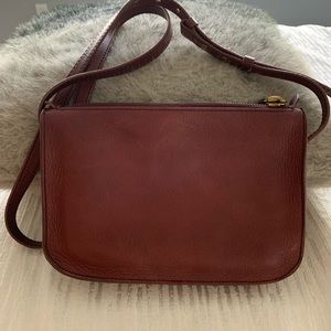 The simple Madewell crossbody bag in maroon.